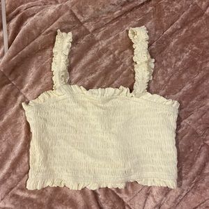Cute cropped tank. Cream color. Gold accents.